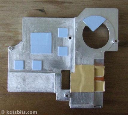 Heatsink and the 'heat compound' pads that make up for bad connection between sink and chip